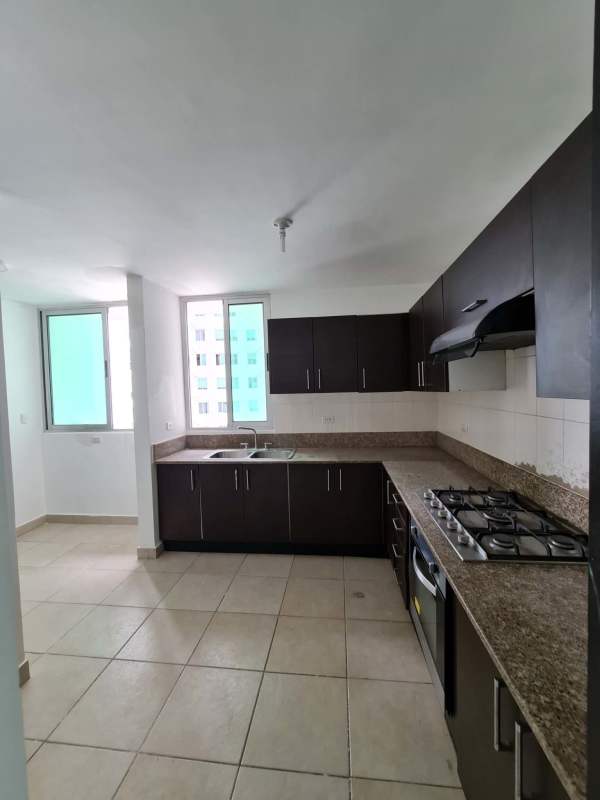 Bedroom with dark wood built-in closet and air conditioning unit in Clayton Park apartment Panama
