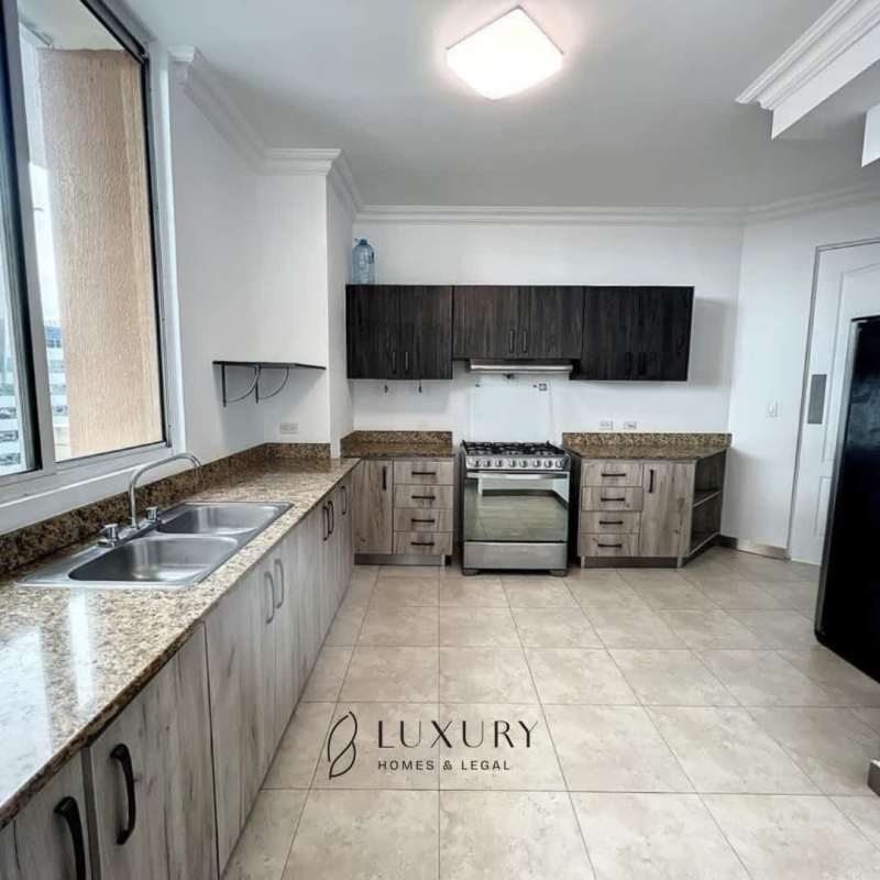 Large kitchen with granite countertops, cabinets, appliances and window in PH Mystic Point Punta Pacifica