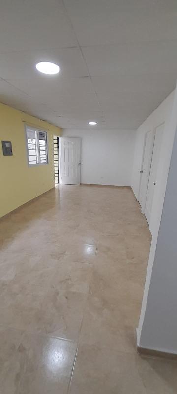 Empty living area with tiles and recessed lighting Villa de Las Acacias Llano Bonito Panama