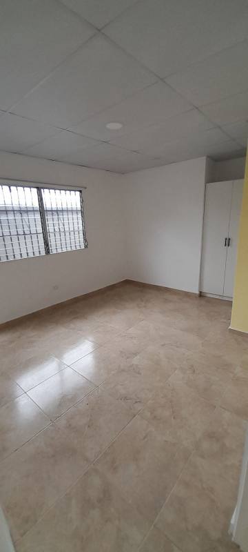Empty bedroom with white built-in wardrobe tiled floor Villa de Las Acacias Llano Bonito Panama