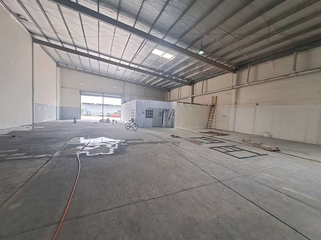 Large industrial warehouse space with concrete floor and high ceiling at Costa del Este Panama