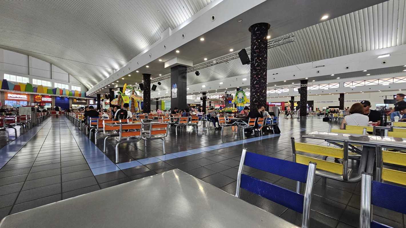 Spacious food court designed with skylights and franchise eateries inside Albrook Mall Panama City