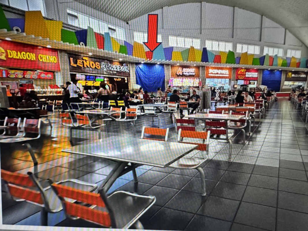 Wide open food court retail units with high ceilings inside Albrook Mall Panama City