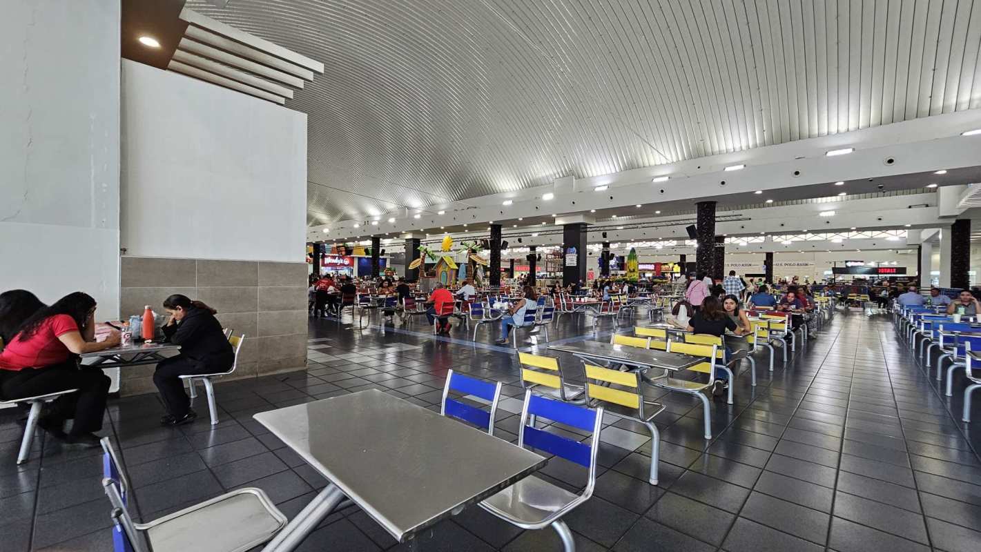 Retail kiosk space surrounded by popular food outlets inside Albrook Mall food court Panama