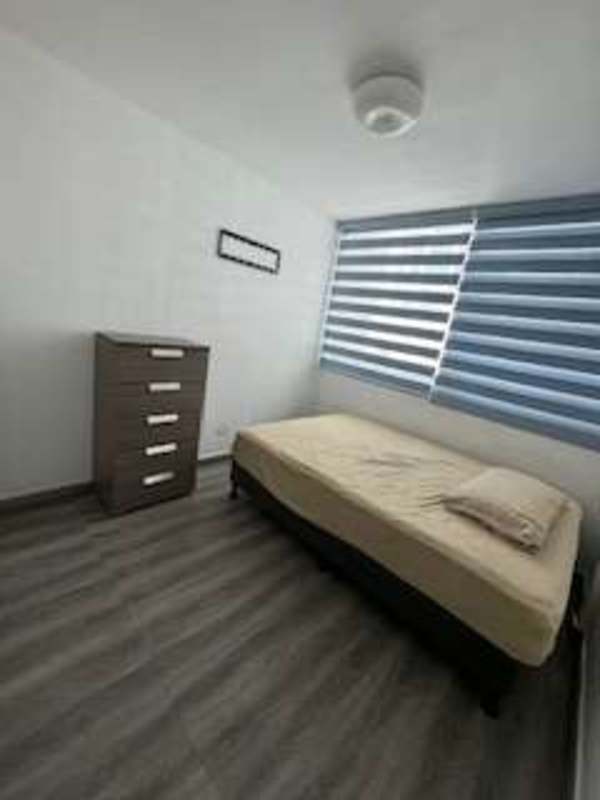 Spacious living room with large window in PH Barcelona View Carrasquilla Panama City