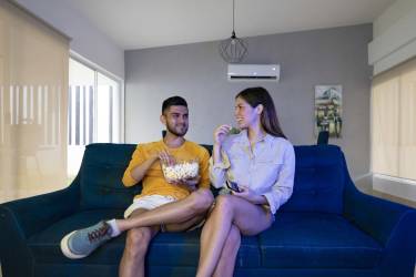 Large outdoor swimming pool surrounded by palm trees and lounge chairs in Paradise Point gated community Coronado Panama