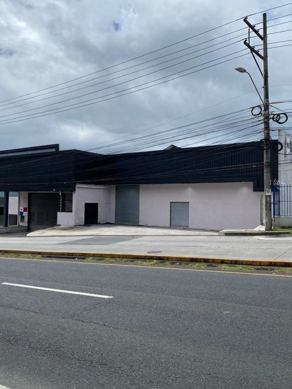 Wide street view of warehouse with rolling doors in Betania Panama City