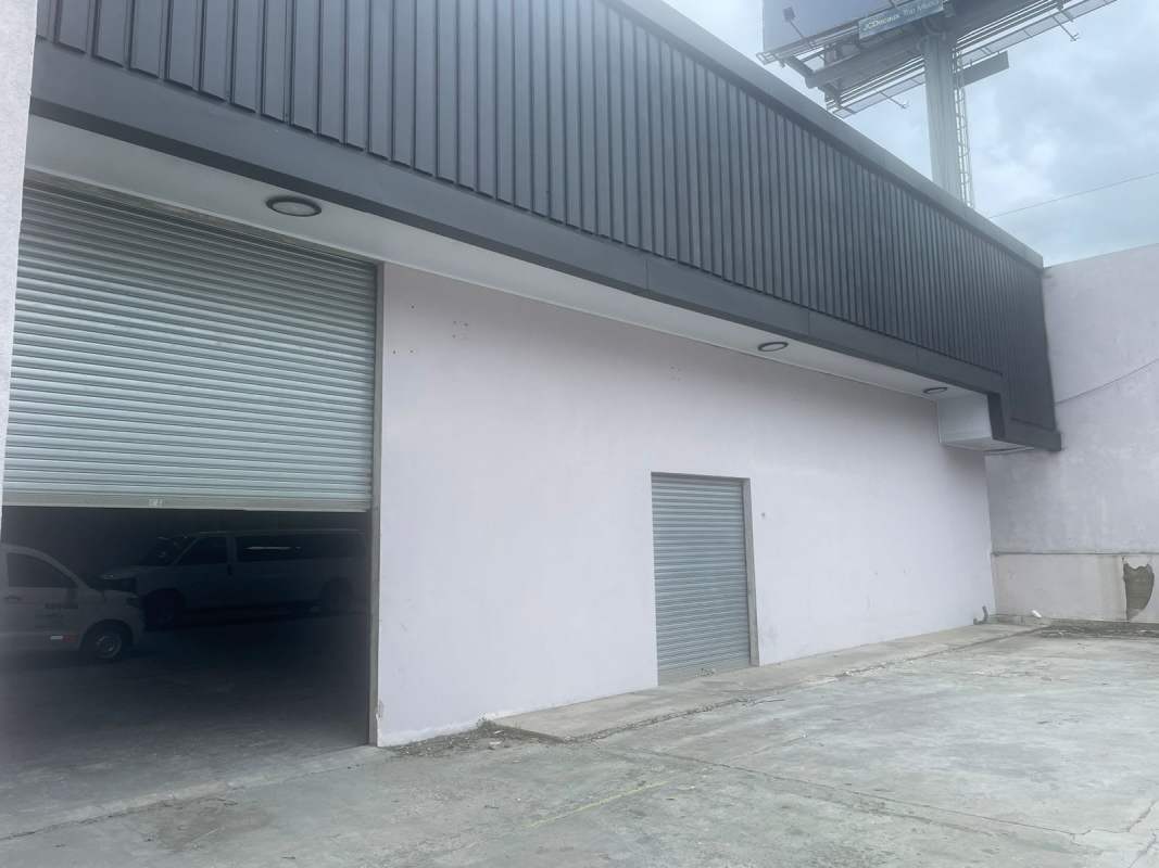 Commercial warehouse entrance with metal rolling garage door Betania Panama City