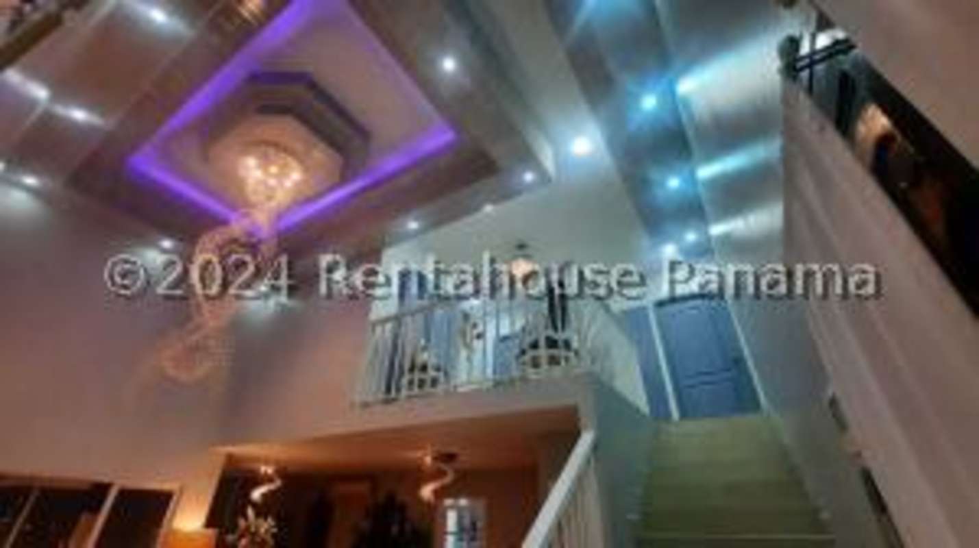 Enclosed balcony sunroom with panoramic night views in Altos de Panamá Panama City