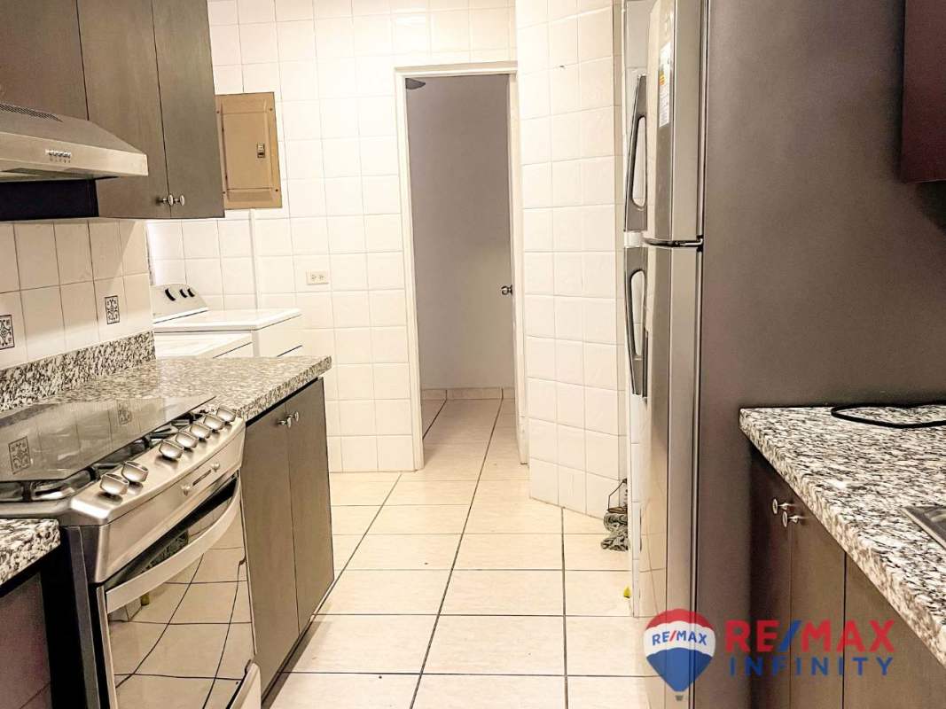 Kitchen with granite counters and stainless appliances in PH Coco del Mar Panama