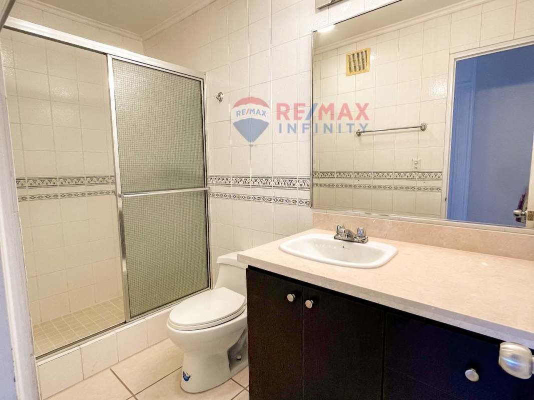 Contemporary bathroom with glass shower and vanity at PH Coco del Mar