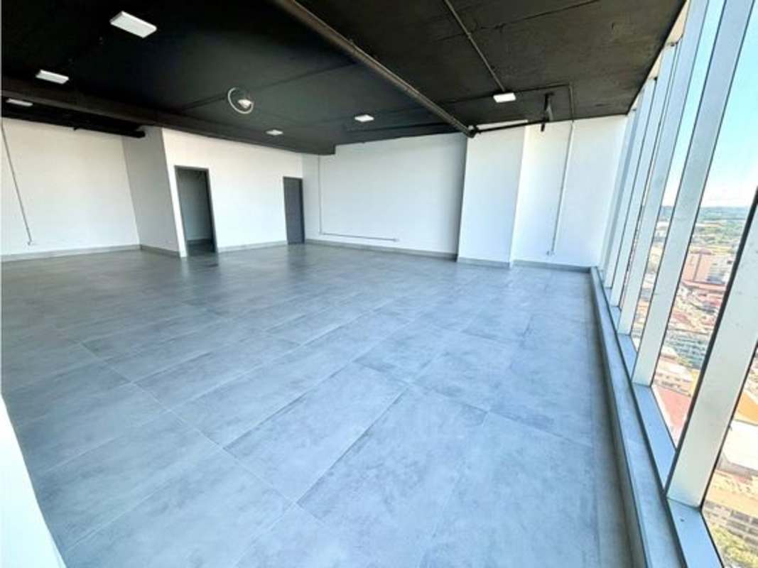 Industrial exposed ceiling and large windows of office space PH Balboa Office tower Panama