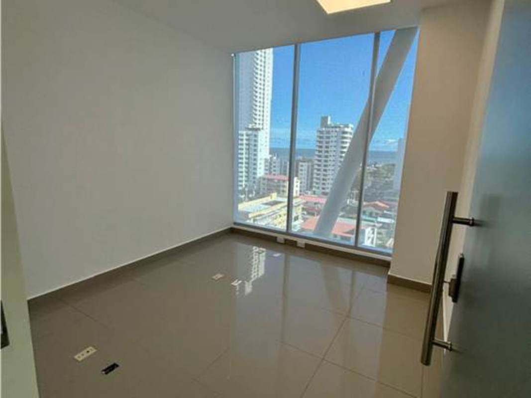 Minimalist tiled bathroom with pedestal sink office PH Office 77 Panama