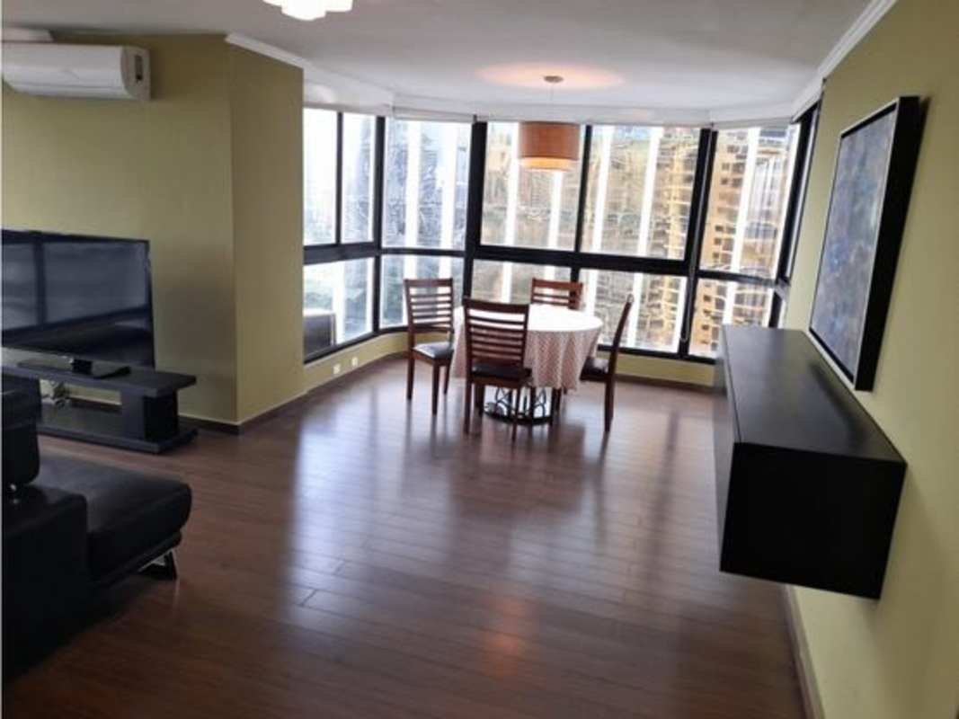 Furnished bedroom with ocean view window in PH Coral Reef Panama City