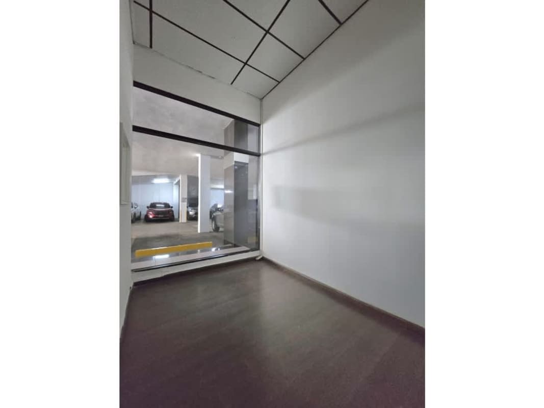 Interior hallway with drop ceiling and fluorescent lighting commercial unit for rent Avenida Balboa Panama