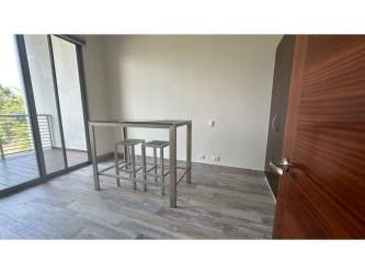 Dining space with sliding doors to balcony in PH Mosaic Panama Pacifico apartment