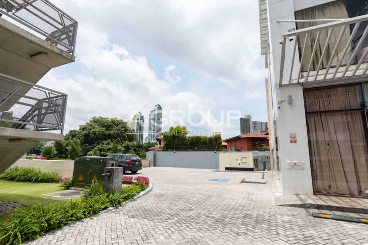 Modern commercial plaza with driveway, parking and towers in background located in Obarrio Panama City Plaza Brazil 50