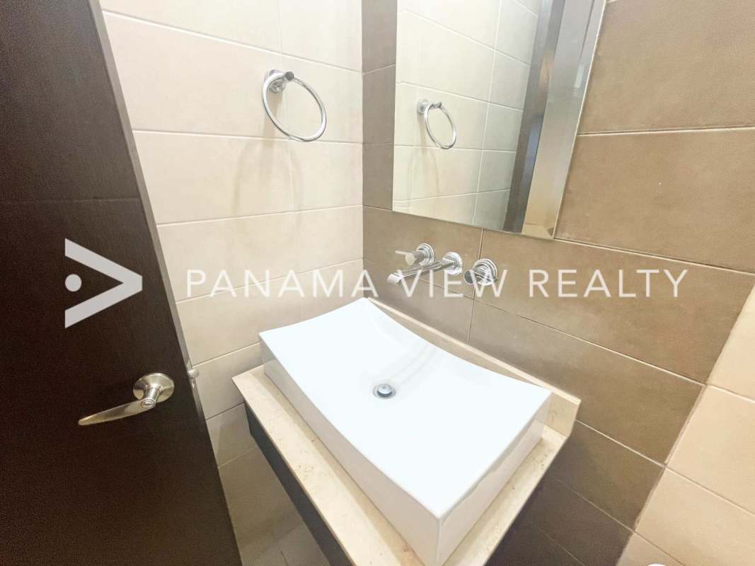 Contemporary bathroom with vessel sink, large mirror and neutral tiles at PH Country Club Costa del Este