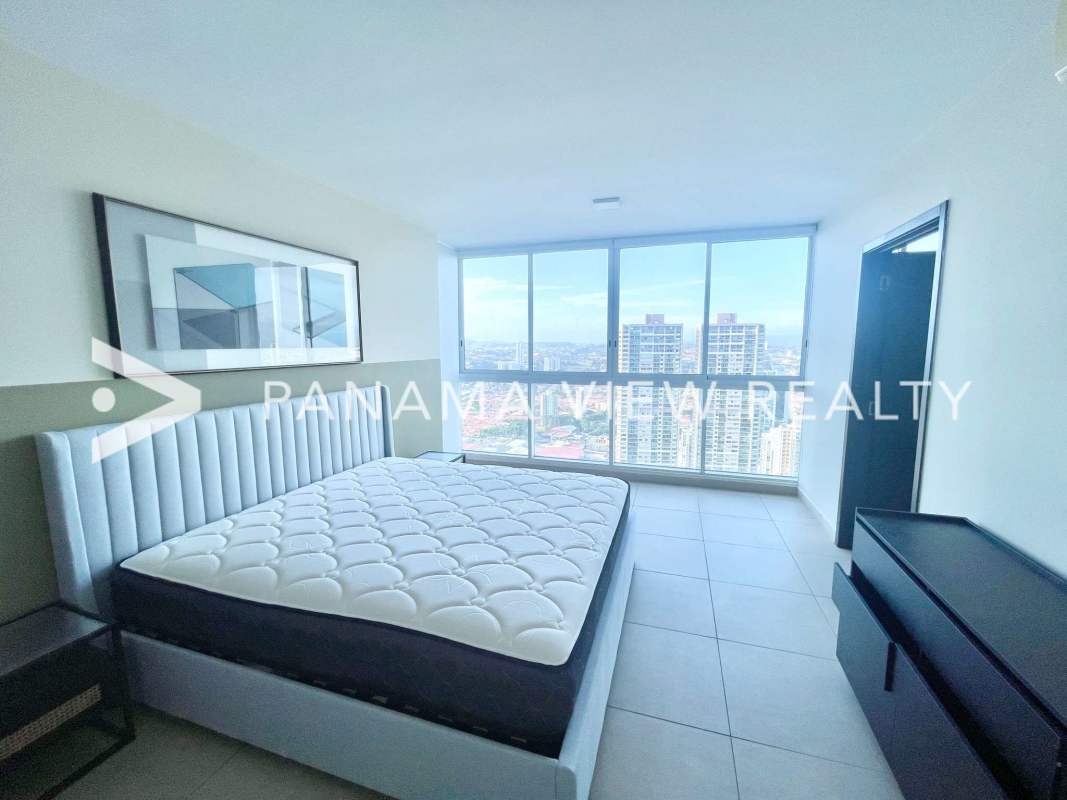 Stylish minimalist bedroom with large windows and city views in PH Country Club Costa del Este Panama
