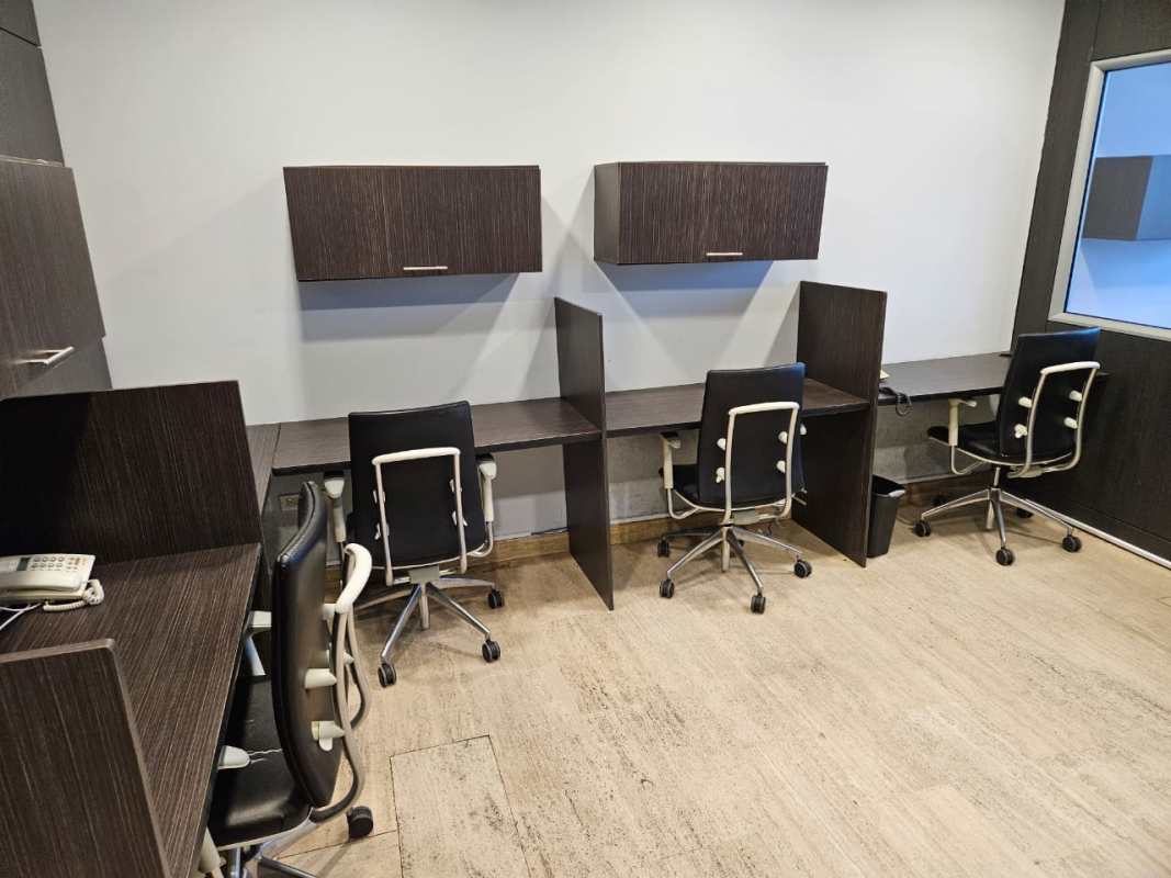 Partitioned desks and chairs at Torre Las Américas commercial office space Panama