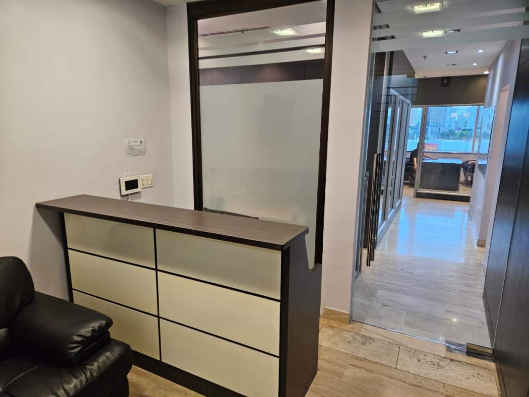 Reception desk with glass partitions and corridor at Torre Las Américas office space Panama City