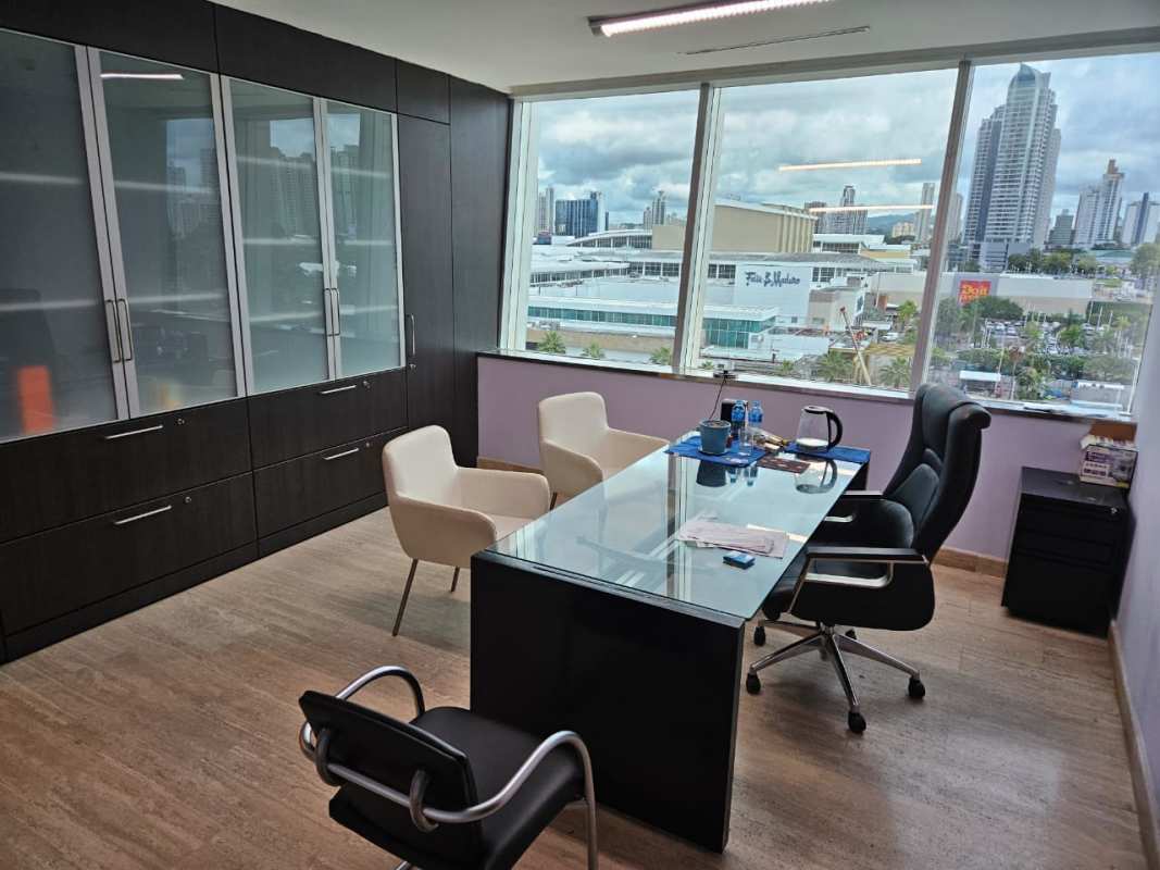 Office room with glass desk, panoramic window and built-in cabinets in Torre Las Américas Panama