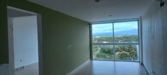 Studio interior with balcony facing pool at Ibiza Condo Hotel Playa Coronado Panama