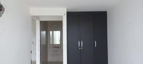 Bedroom and bath area inside Ibiza Condo Hotel studio apartment Coronado Panama