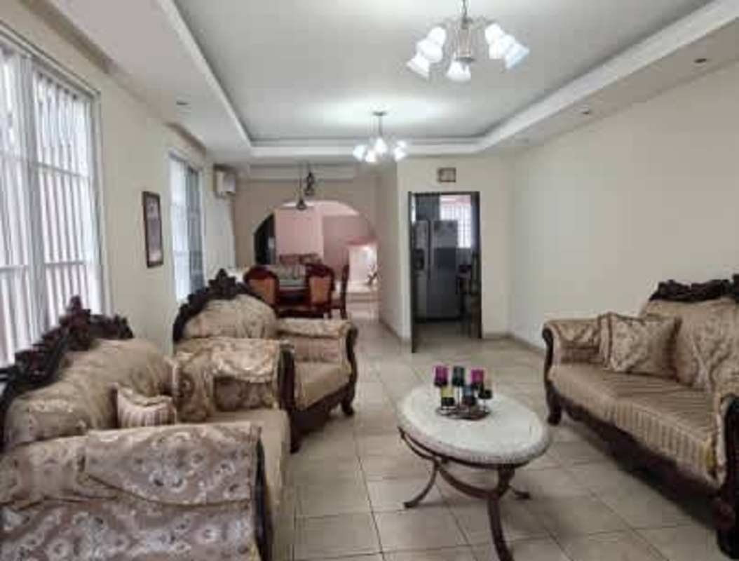 Renovated kitchen with double sink, wood cabinets, spacious countertops in Brisas del Golf Panama house for sale