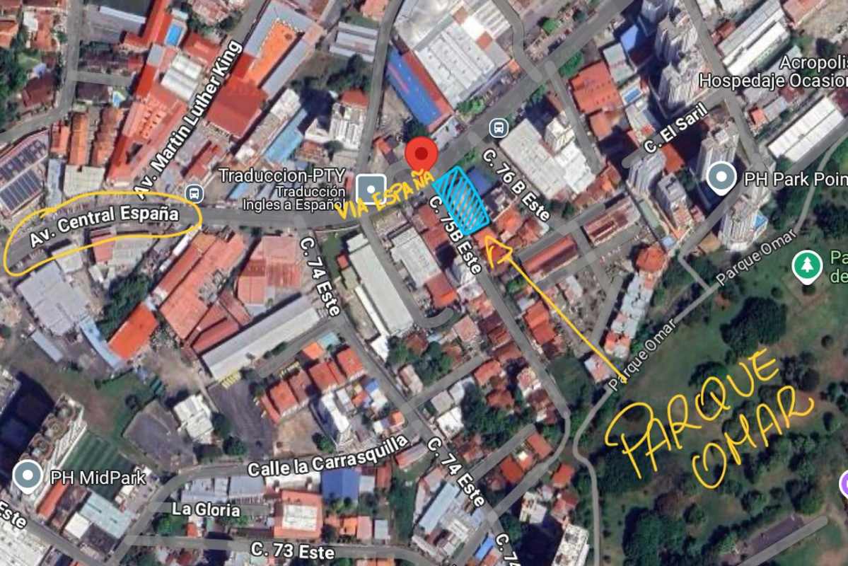 Two-story building with large grassy yard on urban development site Carrasquilla Panama