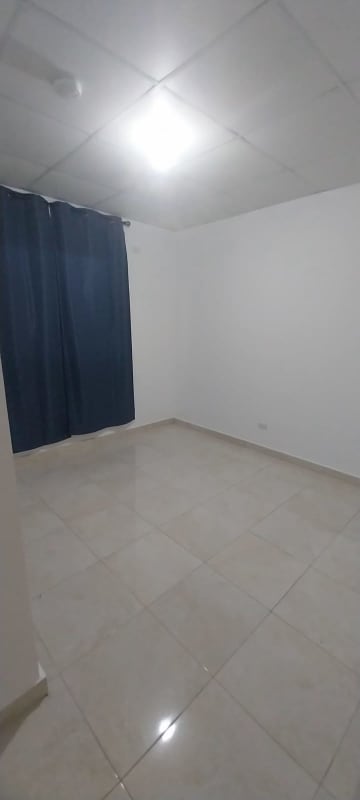 Bedroom with tile floors, window blinds and neutral colors at Cumbres del Lago Panama