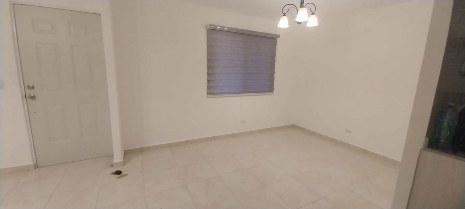 Kitchen with granite countertops, gas stove, microwave, tiled splashback in Cumbres del Lago Panama City