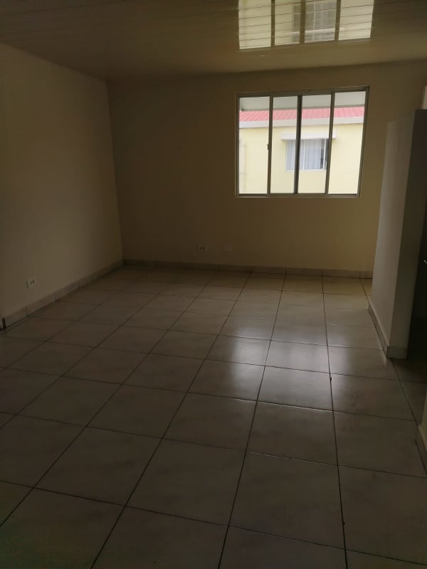 Minimalist kitchen area with granite countertop, tiled walls at PH Montserrat Panama