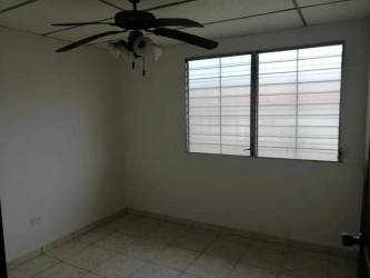 Minimalist kitchen with tile floor, dark cabinets, open serving counter, white walls, Residencial Altamira Vacamonte Panama