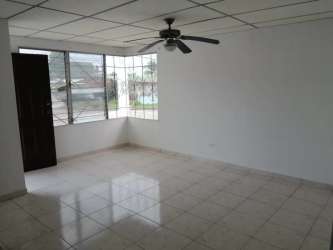 Exterior of house showing front porch, paved yard, perimeter fence at Residencial Altamira Vacamonte Panama