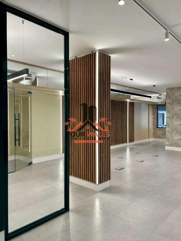 Spacious commercial office interior with glass partitions, wood accents in PH Ejecutivo Panama City