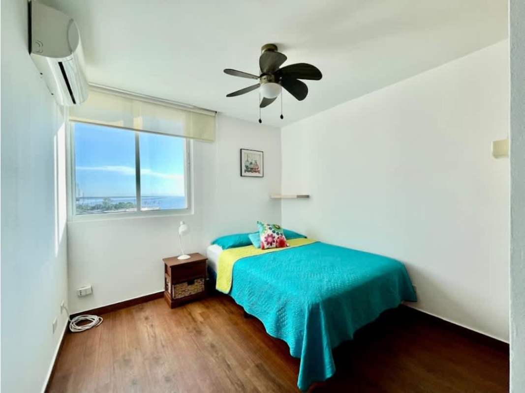 Open living and dining area with access to balcony overlooking Panama City PH Terramar