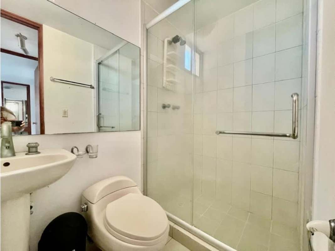 Modern bathroom with glass enclosed shower and pedestal sink in PH Terramar