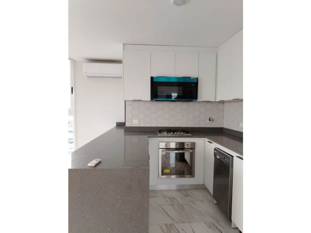 Living area with marble flooring, floor-to-ceiling windows, balcony access with ocean views at The Sands Panama