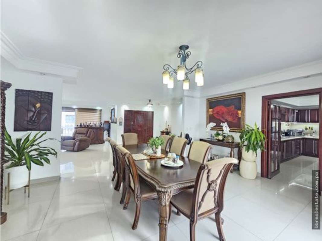 Decorative staircase with metal railing and console table Altos del Golf luxury house