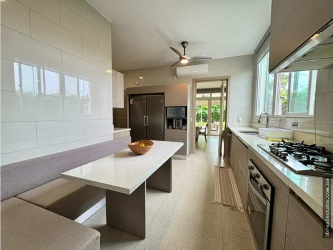 Spacious master bedroom with large windows overlooking golf course The Grove Santa Maria Panama