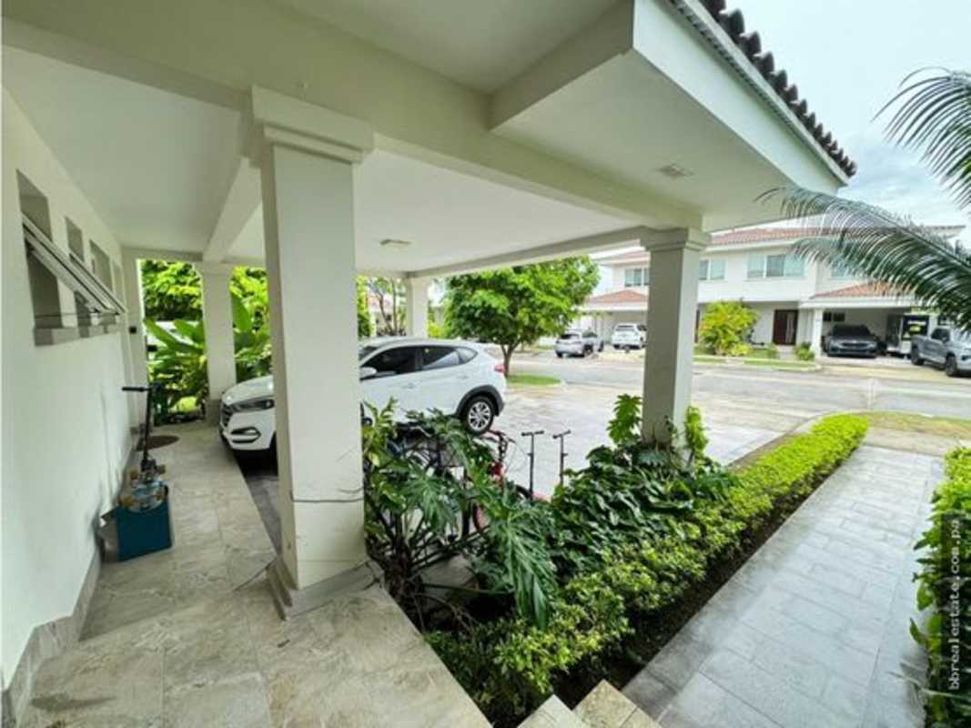 Kitchen with granite countertops, island, and top appliances luxury home Santa Maria Panama