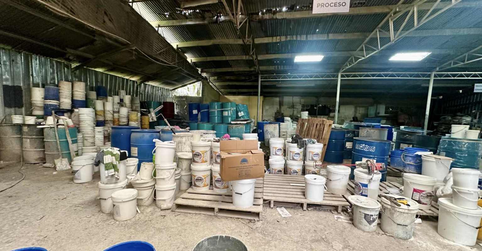 Plastic barrels and containers storage inside industrial warehouse Panama