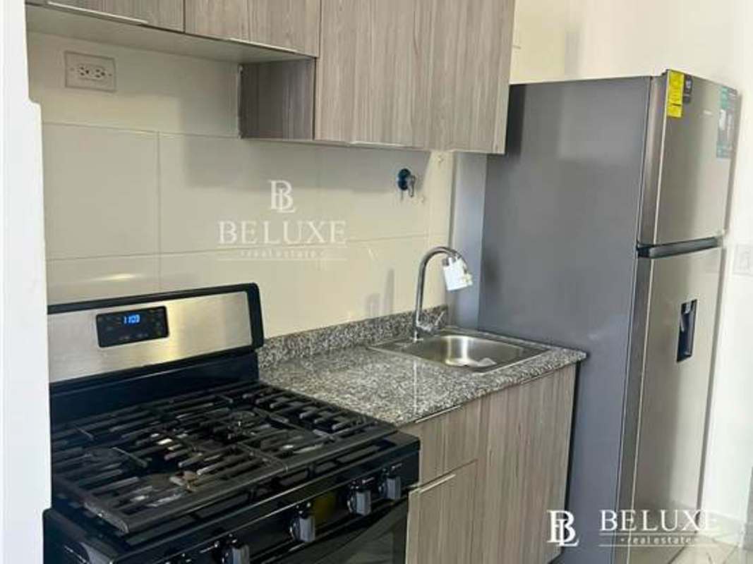 Modern gym with city skyline views at PH The Gray Panama City