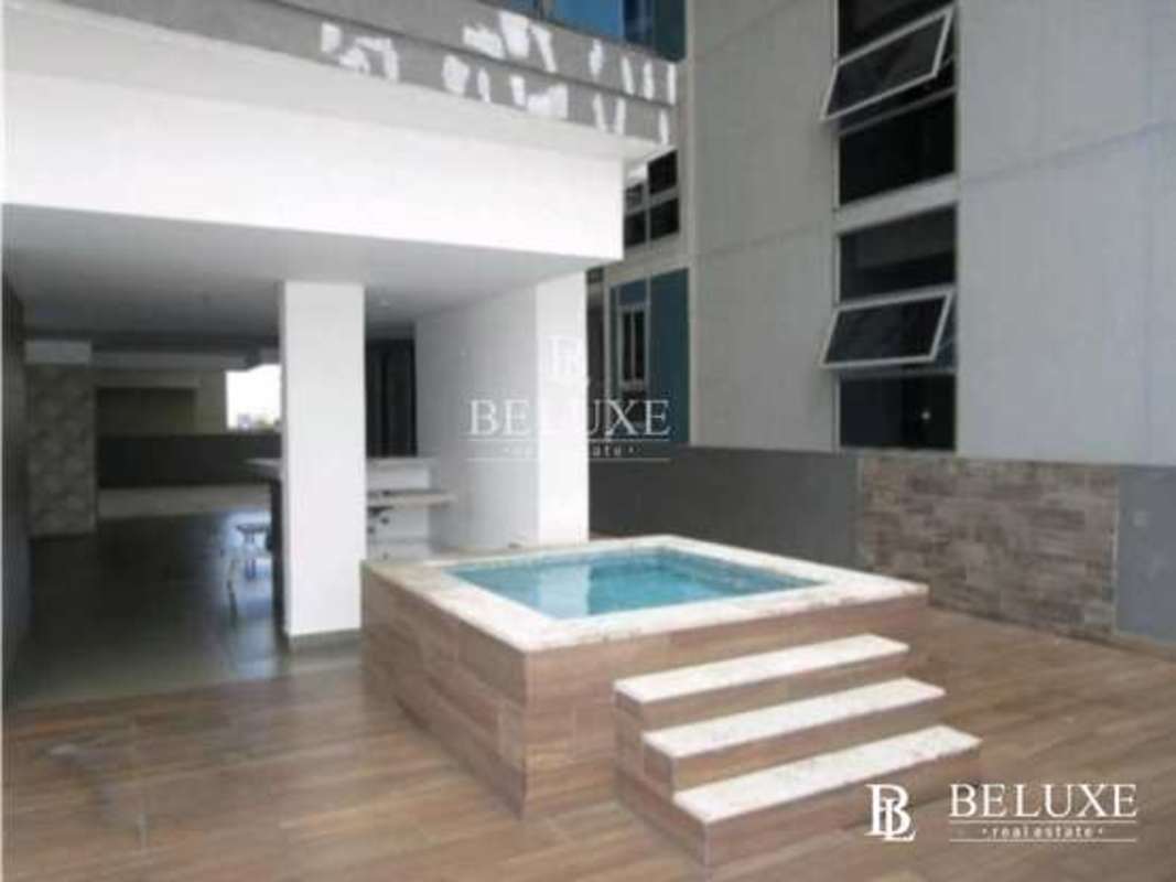 Rooftop children's playground with colorful slide and safety flooring PH Canvas Parque Lefevre Panama