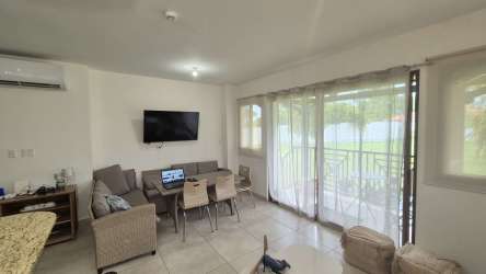 Open living and dining space with natural light and balcony access in PH Mistral Coronado