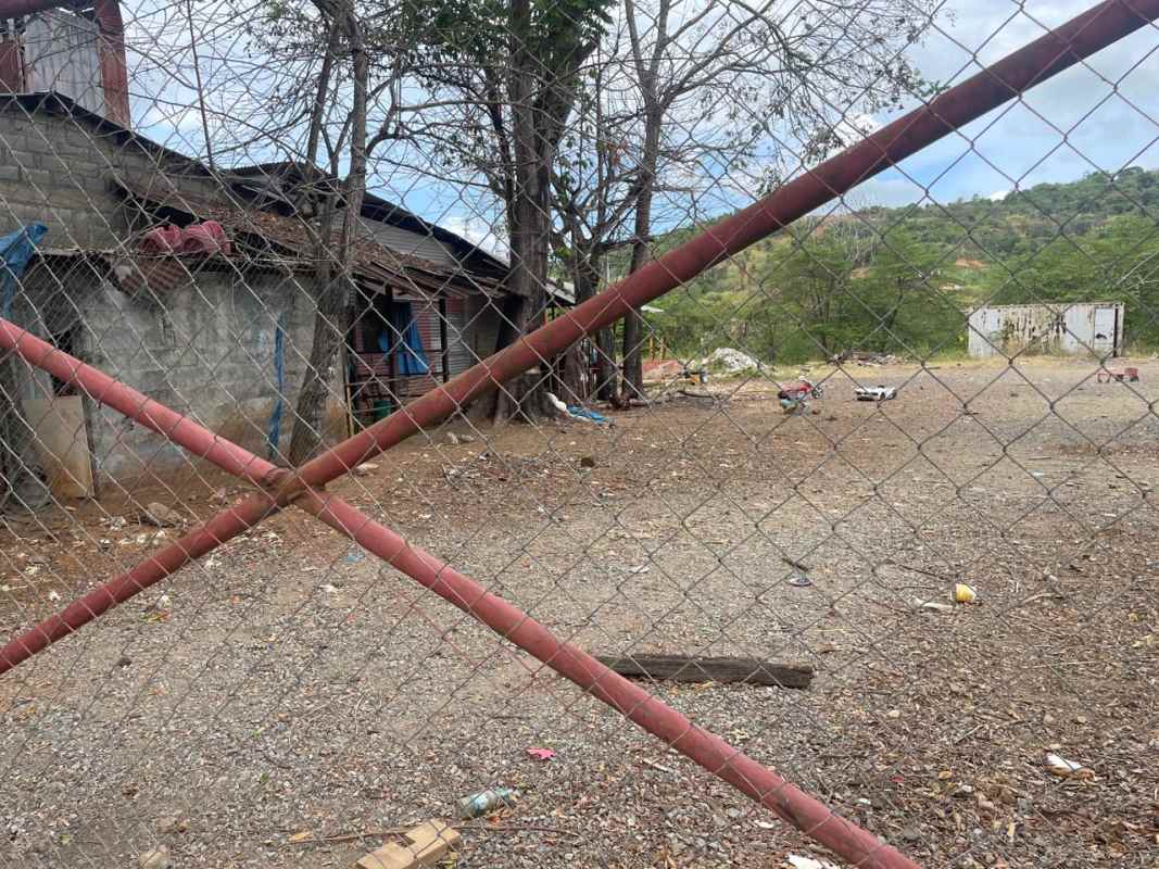 Open cleared lot area fenced with some natural tree cover in Tocumen near Altos de Tocumen Panama
