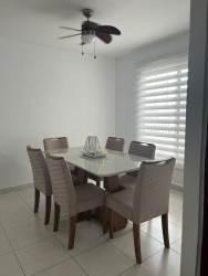 Dining room with ceiling fan, ceramic floor and natural light PH Islas de Montelimar Chorrera Panama