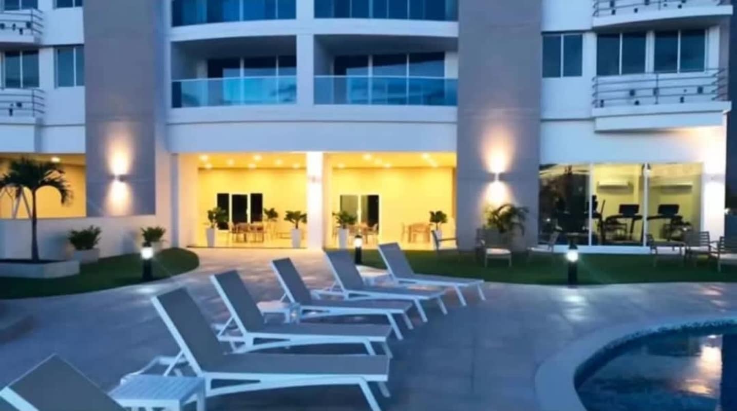 Outdoor swimming pool and jacuzzi area in residential tower PH Villa de las Fuentes Panama City