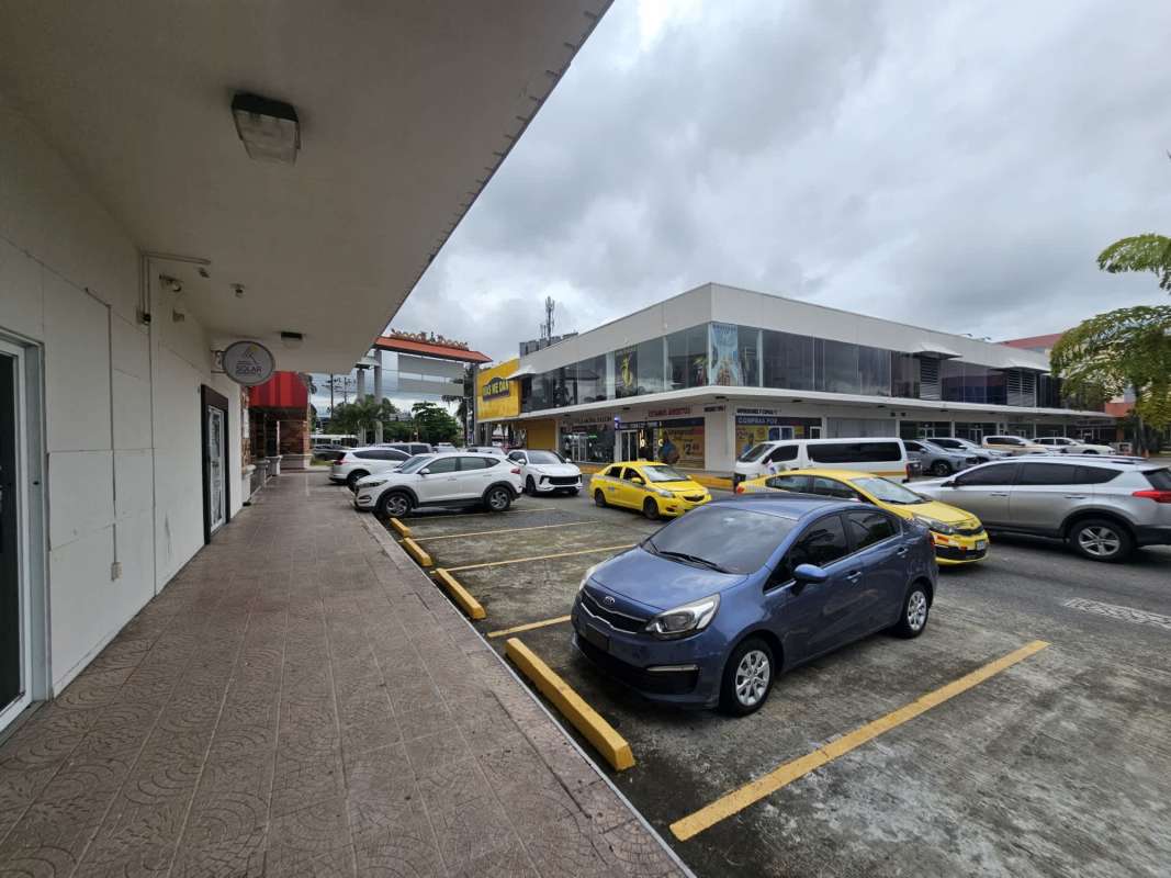 Retail units with glass storefronts and commercial signage at Los Pueblos Panama